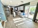 Bright kitchen features gray cabinets, stainless appliances, and a sliding glass door to the back patio at 4223 Kestrel Ct, Indianapolis, IN 46254