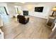 Bright living room featuring modern flooring, fireplace, and comfortable furnishings at 4223 Kestrel Ct, Indianapolis, IN 46254