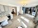 Open-concept living area featuring modern gray cabinets, updated countertops, and lots of natural light at 4223 Kestrel Ct, Indianapolis, IN 46254