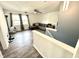 Bright living room featuring a large sectional sofa, ceiling fan, and plenty of natural light at 4223 Kestrel Ct, Indianapolis, IN 46254