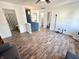 Spacious living room area featuring wood floors, neutral wall color, and access to the bathroom at 4223 Kestrel Ct, Indianapolis, IN 46254