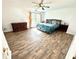 Spacious main bedroom featuring wood-look flooring and ample natural light at 4223 Kestrel Ct, Indianapolis, IN 46254