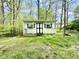 Charming backyard outbuilding with quaint windows and front porch at 4223 Kestrel Ct, Indianapolis, IN 46254