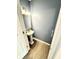 Stylish powder room featuring a pedestal sink, modern fixtures, and a calming blue color scheme at 4223 Kestrel Ct, Indianapolis, IN 46254