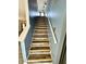 Beautiful wooden staircase leading to the upper level with blue walls and white railings at 4223 Kestrel Ct, Indianapolis, IN 46254