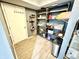 Spacious storage room with shelving, a hanging rack, and room for organizing household items at 4223 Kestrel Ct, Indianapolis, IN 46254