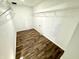 Bright walk-in closet with wood-look flooring and white wire shelving for ample storage space at 4223 Kestrel Ct, Indianapolis, IN 46254