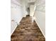 Spacious walk-in closet featuring hardwood flooring and metal shelving, leading to a bright doorway at 4223 Kestrel Ct, Indianapolis, IN 46254