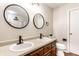 A well lit bathroom offers double sinks and updated fixtures at 4303 Cowslip Ct, Indianapolis, IN 46203