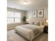 Serene bedroom with neutral tones, a plush bed, and a large window for natural light at 4303 Cowslip Ct, Indianapolis, IN 46203