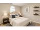 Comfortable bedroom with a cozy bed, accent pillows, and stylish decor and lighting at 4303 Cowslip Ct, Indianapolis, IN 46203