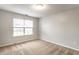 Neutral bedroom with carpet, a window letting in natural light, and freshly painted walls at 4303 Cowslip Ct, Indianapolis, IN 46203
