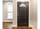 Stylish front door with decorative window and sidelight providing natural light to the entry at 4303 Cowslip Ct, Indianapolis, IN 46203