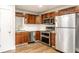 Modern kitchen with stainless steel appliances, stylish dark cabinets, and sleek countertops at 4303 Cowslip Ct, Indianapolis, IN 46203