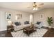 Cozy living room featuring a comfortable sofa, stylish decor, and a serving hatch at 4303 Cowslip Ct, Indianapolis, IN 46203