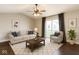 Cozy living room featuring a comfortable sofa, stylish decor, and a sliding glass door at 4303 Cowslip Ct, Indianapolis, IN 46203