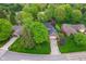 Home with mature trees and green landscaping, a brick and siding home with an in-ground pool at 4401 W Hunters Ridge W Ln, Greenwood, IN 46143