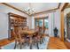 Inviting dining area with hardwood floors, a chandelier, and a wooden hutch for a classic touch at 4401 W Hunters Ridge W Ln, Greenwood, IN 46143