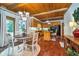 Charming kitchen with wood-paneled ceilings, island, and adjacent dining area at 4401 W Hunters Ridge W Ln, Greenwood, IN 46143