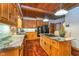 Bright kitchen showcasing granite countertops, wood cabinets, and stainless steel appliances at 4401 W Hunters Ridge W Ln, Greenwood, IN 46143