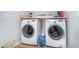 Convenient laundry room featuring modern washer and dryer units and ample space at 4401 W Hunters Ridge W Ln, Greenwood, IN 46143