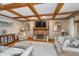 Inviting living room with coffered ceiling, brick fireplace, and comfortable seating area at 4401 W Hunters Ridge W Ln, Greenwood, IN 46143
