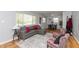 Bright living room with modern decor, hardwood floors, a comfortable couch, and natural light at 4468 N Elizabeth St, Indianapolis, IN 46226