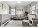 Bedroom with a crib, sofa, neutral colors, and plentiful natural light at 5124 N Capitol Ave, Indianapolis, IN 46208