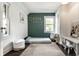 Bright bedroom featuring hardwood floors, a large window, and modern decor at 5124 N Capitol Ave, Indianapolis, IN 46208
