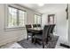 Elegant dining room with a large table, seating for six, and natural light, perfect for hosting gatherings and meals at 5124 N Capitol Ave, Indianapolis, IN 46208