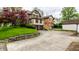 Brick home featuring two car garage, well maintained yard, and classic charm at 5124 N Capitol Ave, Indianapolis, IN 46208