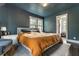 Inviting primary bedroom with a large bed, soft lighting, and view into the closet at 5124 N Capitol Ave, Indianapolis, IN 46208