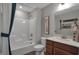 Well-lit bathroom features a shower-tub combo, vanity with storage, and modern fixtures at 5163 Nettleton Way, Avon, IN 46123