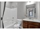 Bathroom featuring a shower-tub combo and a wood vanity at 5163 Nettleton Way, Avon, IN 46123