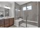 This bathroom showcases a glass-enclosed shower with a built-in bench and tile surround, creating a spa-like experience at 5163 Nettleton Way, Avon, IN 46123