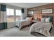 Inviting bedroom with twin beds, wood-paneled accent wall, and plenty of natural light at 5163 Nettleton Way, Avon, IN 46123