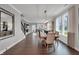 Bright dining room with wood floors, stylish light fixture and large windows at 5163 Nettleton Way, Avon, IN 46123