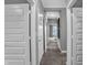 Hallway with multiple doors and access to other rooms of the home at 5163 Nettleton Way, Avon, IN 46123