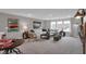 Comfortable living room with sectional sofa, decorative pillows, coffee table, and bright windows at 5163 Nettleton Way, Avon, IN 46123