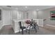 Bright loft features a round game table, two chairs, and a doorway leading to another room at 5163 Nettleton Way, Avon, IN 46123