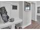 Mudroom featuring a custom bench, hooks, and golf bag storage at 5163 Nettleton Way, Avon, IN 46123