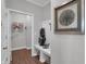 Functional mudroom with storage bench, golf bag, and stylish decor at 5163 Nettleton Way, Avon, IN 46123