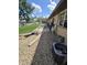 Backyard patio with an AC unit, seating area, and rock garden at 5218 Fletcher St, Anderson, IN 46013