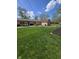 Spacious backyard with a shed, seating area, and well-maintained lawn at 5218 Fletcher St, Anderson, IN 46013