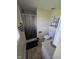 Compact bathroom with a shower, toilet, vanity, and medicine cabinet at 5218 Fletcher St, Anderson, IN 46013