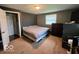 Comfortable bedroom with carpet floors, and large closet at 5218 Fletcher St, Anderson, IN 46013
