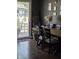 Dark dining room with wood floors and sliding glass doors leading to backyard at 5218 Fletcher St, Anderson, IN 46013