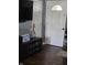 Inviting entryway featuring hardwood floors, modern decor, and a view of interior doors at 5218 Fletcher St, Anderson, IN 46013