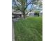 Well-manicured front yard with mature trees offering shade and curb appeal at 5218 Fletcher St, Anderson, IN 46013