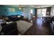 Spacious living room showcasing hardwood floors, a cozy couch, and modern finishes at 5218 Fletcher St, Anderson, IN 46013